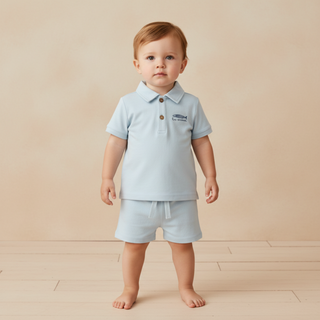 Makemake Organics organic polo shirt and shorts set in light blue, 2-piece outfit for kids, made from organic materials.