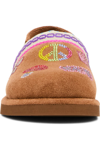 Steve Madden Toddler Chip Faux Suede Clog - Cognac Multi
A tan suede slipper with colorful beaded peace sign and paisley patterns on the upper, set against a plain white background.