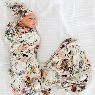 Lou Lou and Company Swaddle Blanket - Nellie
Newborn baby wrapped in a floral swaddle blanket on a white background