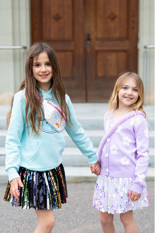 Great Pretenders rainbow and butterfly fanny pack featuring colorful design and adjustable strap for kids' playful accessories.