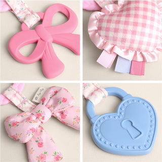 Itzy Ritzy Bow Bitzy Busy Ring™ activity toy with colorful rings and bow design for babies.