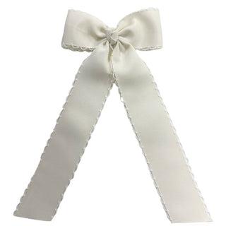 Antique White Wee Ones Medium Moonstitch Grosgrain Streamer Hair Bow on Clippie 
White bow with ruffled edges on a white background