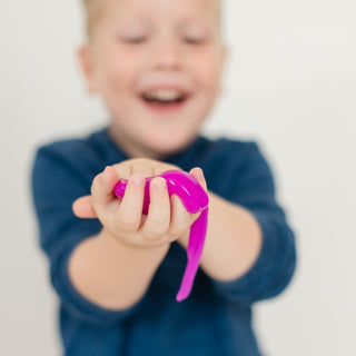 Jollity & Co Trick or Treat Street Ghost Slime
Child holding a pink object with a blurred background