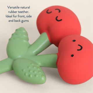 Itzy Ritzy Comfort Crew™ cherry-shaped silicone teether for babies with red and white cherry design, soft and easy to hold.
