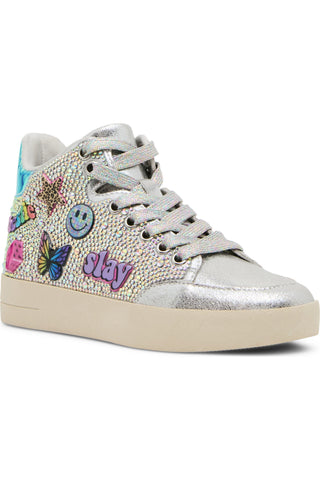 Steve Madden Kid's Delight High Top Sneaker - Silver
A silver high-top sneaker embellished with iridescent rhinestones, colorful embroidered patches including a smiley face, butterfly, flowers, and the word 'stay', on a white background.
