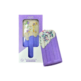 The Lavish Goat Purple Popsicle Prize Bath Bomb
Purple popsicle-shaped bath bomb with decorative toppings in front of its packaging.