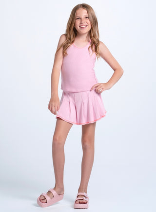 Lucky In Love Girls Chill Play Tank - Paris Pink
Young girl wearing a pink dress on a white background
