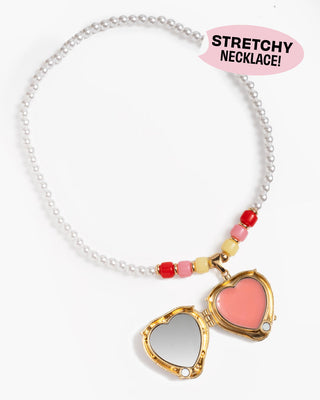 Super Smalls Strawberry Surprise Lipgloss Locket
Necklace with heart-shaped locket and colorful beads on a white background