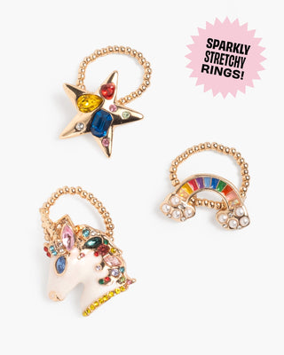 Super Smalls Gloss It Rainbow Lip Gloss Ring Set
Three sparkly stretchy rings with star, unicorn, and rainbow designs on a white background.