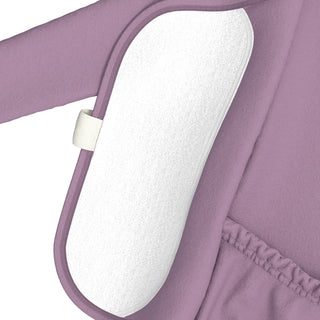 Bonsie Footie - Fig
Close-up of a lavender purple garment with a white textured insert or pad attached by a small white tab, shown against a white background.