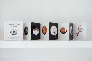 Paige Tate Baby's Tummy Time Sports: A Sports Board Book For Babies
Row of books with sports-themed illustrations on a white shelf