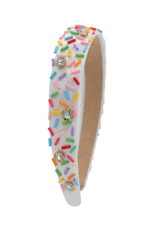 Bari Lynn Sprinkle Jewel Padded Headband - White
A white foam headband decorated with colorful sprinkle-shaped embellishments and rhinestone clusters, shown against a plain white background.