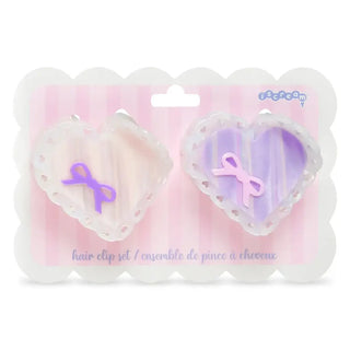 Iscream Heart Bow Hair Clips
Heart-shaped hair clip set with purple bows on a pink background