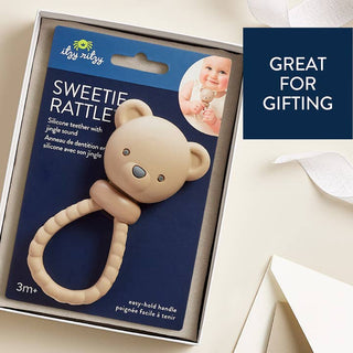 Itzy Ritzy Sweetie Rattle™ - Bear
Itzy Ritzy Sweetie Rattle packaging with a baby holding the rattle on a blue background.