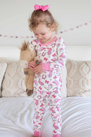 Caden Lane Rodeo Dreams Pink two-piece pajama set for girls with playful rodeo horse print and comfortable fabric