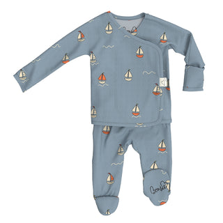 Bonsie Footie - Ahoy Baby
Children's blue pajama set with sailboat pattern on a white background