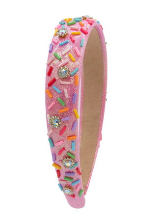 Bari Lynn Sprinkle Jewel Padded Headband - Pink
A pink glitter headband decorated with colorful sprinkle-shaped embellishments and jeweled accents, shown on a plain white background.
