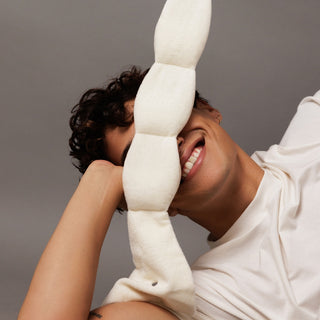 Noppod Weighted Sleep Eye Mask - Bone
Person holding a large white foam noodle against their face on a gray background