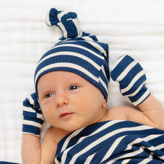 Lou Lou and Company Ribbed Top Knot Hat - Jack
Newborn baby wearing a blue and white striped hat and matching blanket on a white background