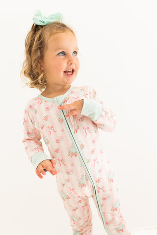 In My Jammers Zipper Romper - Tea PartyChild wearing a floral onesie on a white background