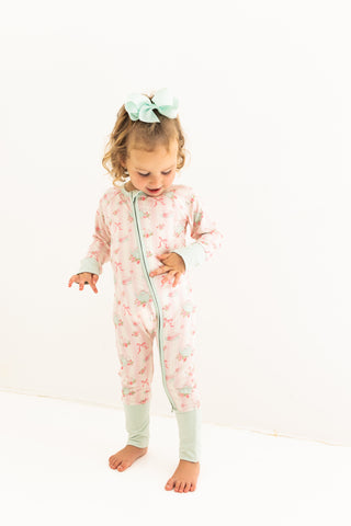 In My Jammers Zipper Romper - Tea Party
Child wearing a floral onesie on a white background
