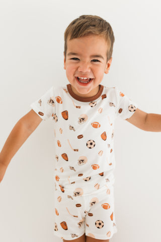 In My Jammers Two Piece Short Set - Sports
Child wearing a white outfit with sports-themed print on a plain background