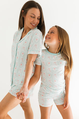 In My Jammers Two Piece Short Set - Eloise
Woman and young girl wearing matching light blue pajama sets with a pattern on a white background