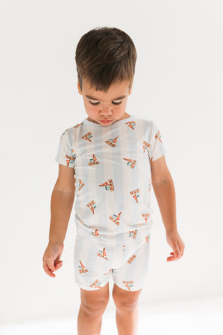 In My Jammers Two Piece Short Set - Little Sailboat
Child wearing a patterned romper on a white background