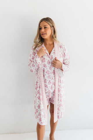 In My Jammers Blush Rose Garden Women's Robe
Woman wearing a pink floral robe against a white background