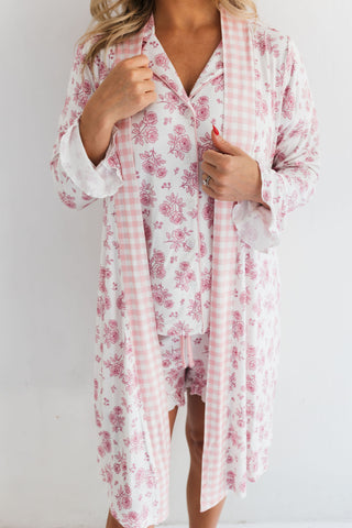 In My Jammers Blush Rose Garden Women's Robe
Woman wearing a floral kimono-style garment against a plain background