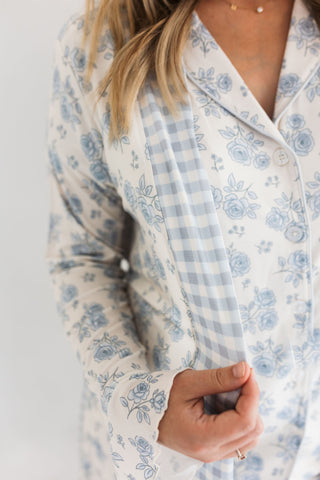 In My Jammers Blue Rose Garden Women's Robe
White pajama top with blue floral and checkered patterns on a plain background