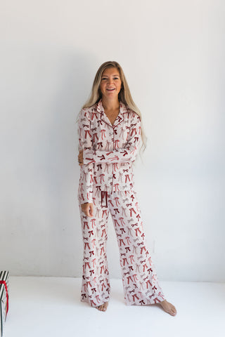 In My Jammers Merry Little Bows Women’s Set
Woman wearing a patterned pajama set on a white background