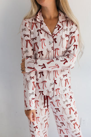 In My Jammers Merry Little Bows Women’s Set
Person wearing a pajama set with red bow pattern on a white background