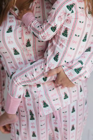 In My Jammers Pinkmas Women’s Set
Close-up of a person wearing a festive pajama set with Christmas tree pattern.
