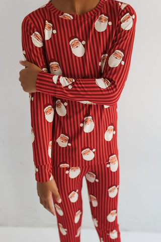 In My Jammers Santa Two Piece Set
Red pajama set with Santa Claus pattern on a white background
