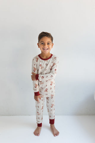 In My Jammers Bear-y Merry Two Piece Set
Child wearing a pajama set with a white background