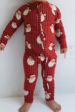 In My Jammers Santa Zipper Romper
Red striped pajama set with Santa Claus pattern on a white background
