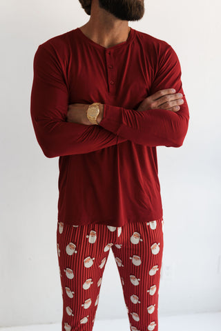 In My Jammers Solid Red Santa Men's Top
Person wearing a red long-sleeve top and patterned red pajama pants on a white background
