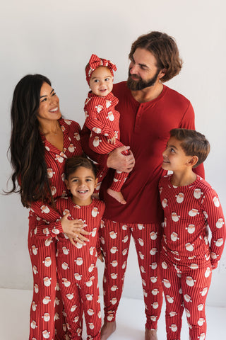 In My Jammers Santa Men's Jogger
Family of four wearing matching red pajamas with white patterns on a plain background
