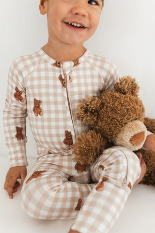 In My Jammers Teddy Gingham zipper romper pajamas featuring a cozy, button-front design and soft, plaid fabric.