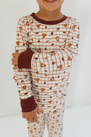 In My Jammers Two Piece Set - Spiced Pie
Child wearing a pajama set with brown and white pattern on a plain background