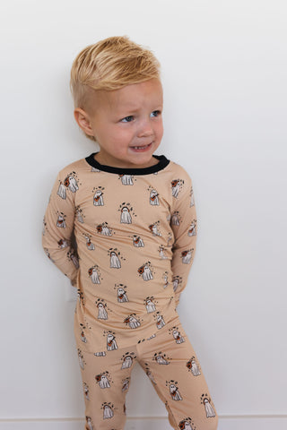 In My Jammers DJ BooMBox Two Piece Set Child wearing a beige pajama set with black trim against a white background
