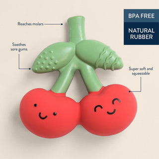 Itzy Ritzy Comfort Crew™ cherry-shaped teether with red and white cherry print for soothing and teething relief for babies.