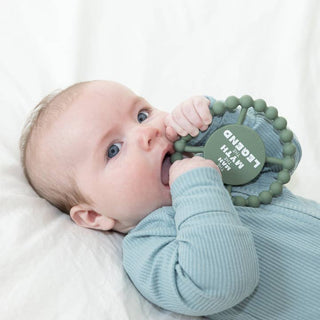 Bella Tunno Happy Teether - Man Myth Legend
Baby chewing on a green teething ring with 'Legend' branding.