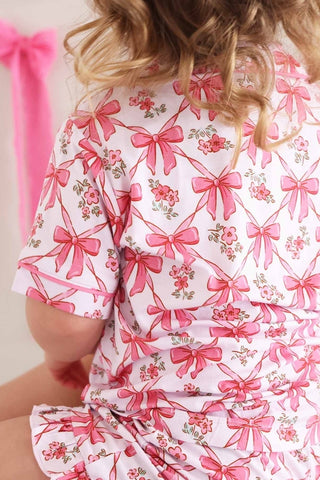 Caden Lane Bow Besties two-piece short lounge set featuring a comfortable pajama top and shorts in a cozy, stylish design.