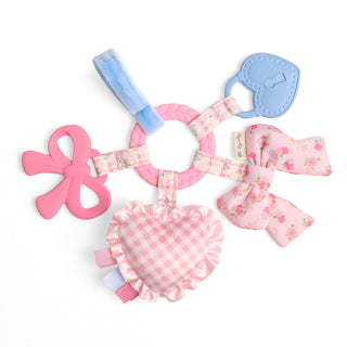 Itzy Ritzy Bow Bitzy Busy Ring™ activity toy with colorful rings and bow design for babies' sensory play.