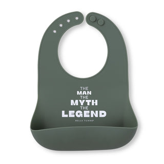 Bella Tunno Wonder Bib - Man Myth Legend
A dark sage green silicone baby bib with a white printed text design that reads 'THE MAN THE MYTH THE LEGEND' and 'BELLA TUNNOP' underneath, shown on a plain white background.