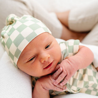 Lou Lou and Company knit top knot hat in Kirby color, featuring soft, cozy fabric and a stylish knot detail for babies or toddlers.