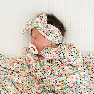 Lou Lou and Company Headband - Millie
Newborn baby wrapped in a floral blanket with a matching headband and pacifier.