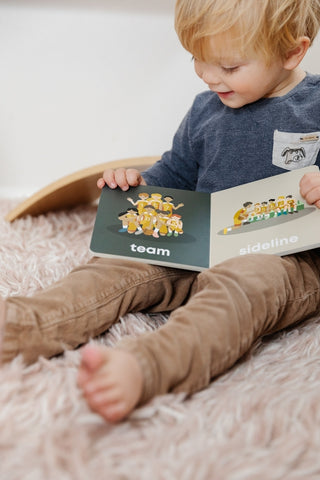Left Hand Book House basketball-themed board book for babies, featuring colorful illustrations on a sturdy cover.